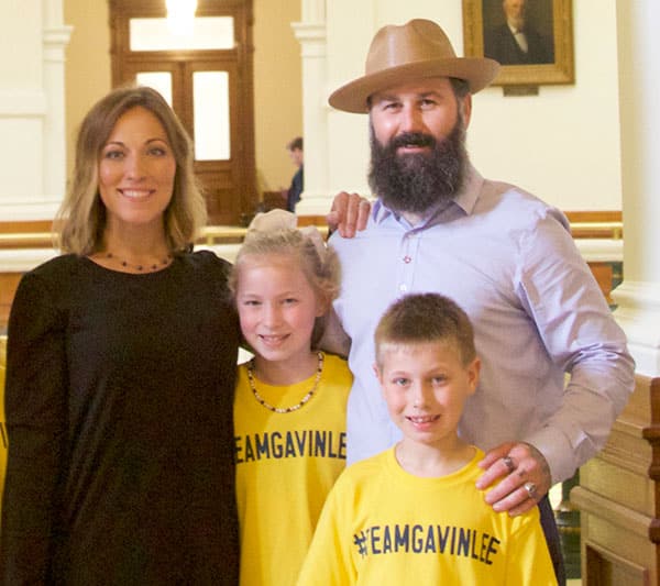  Anna Robbins with her husband, daughter, and son at the Texas State Legislature for Drowning Prevention and Awareness Week 2019.