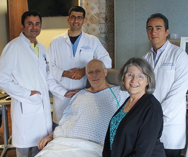 Liver transplant patient Mike Matthews and his wife, Patty, with his team at Methodist Dallas.