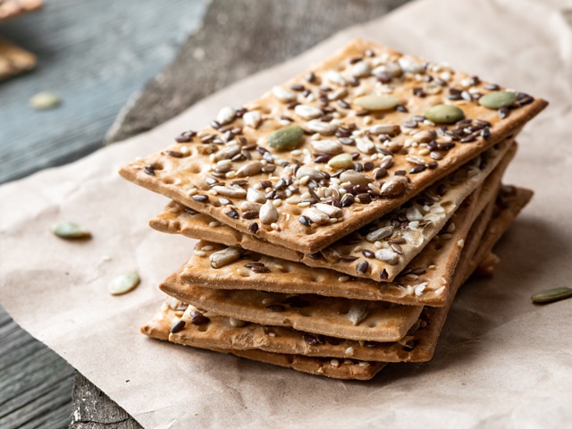 Stack of crackers with seeds as healthy option for snacking in the car.