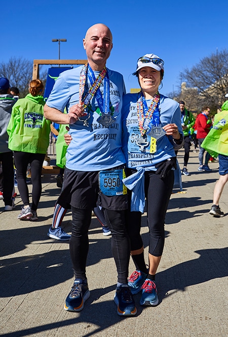 Liver transplant patient Mike Barker and his wife, Fatima, finish a race.