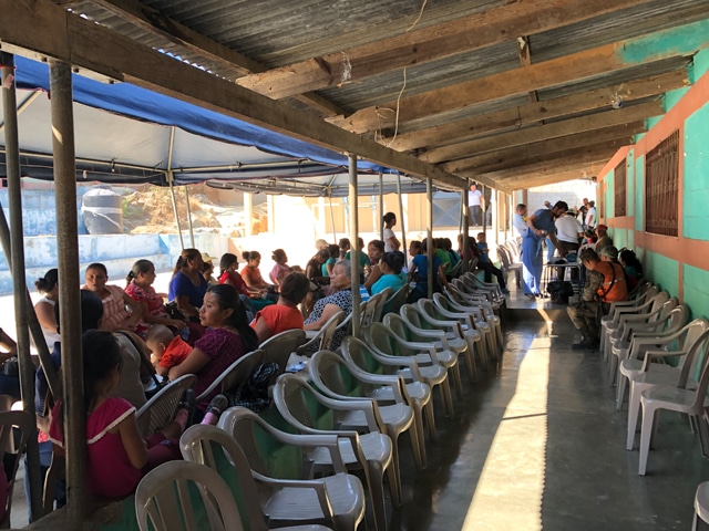 Dozens of patients line up to be seen at a medical clinic in a rural Guatemalan village during a Methodist medical mission trip.