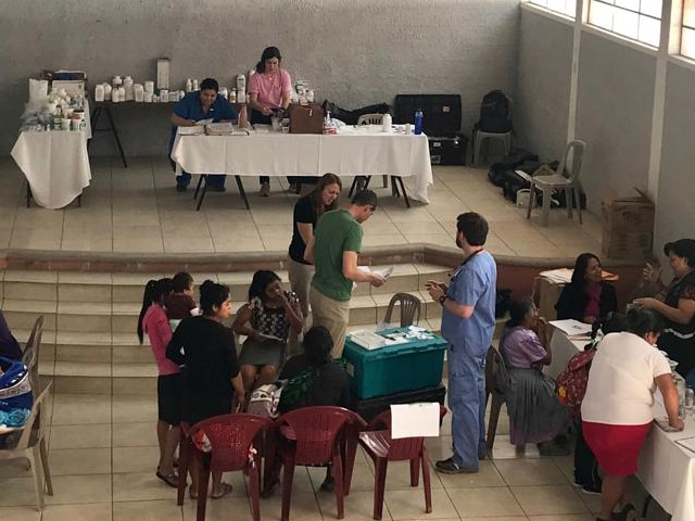 A makeshift medical clinic in the community center of a rural Guatemalan village during a Methodist medical mission trip.