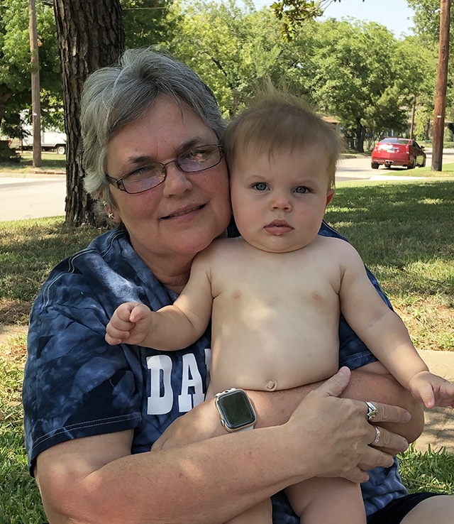 After her kidney transplant, patient poses with her grandson.