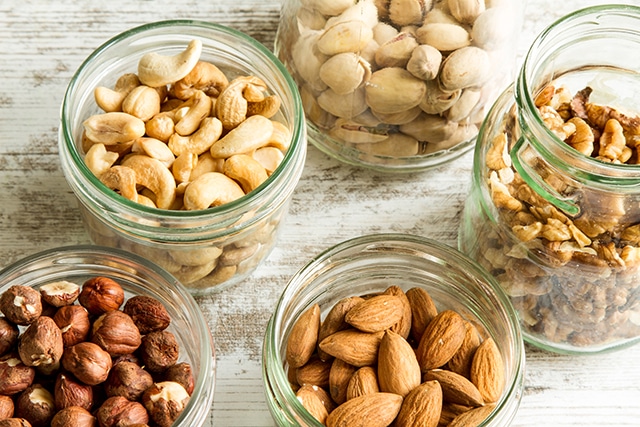 Jars of various nuts, which are a common allergy and can be substituted in many recipes.