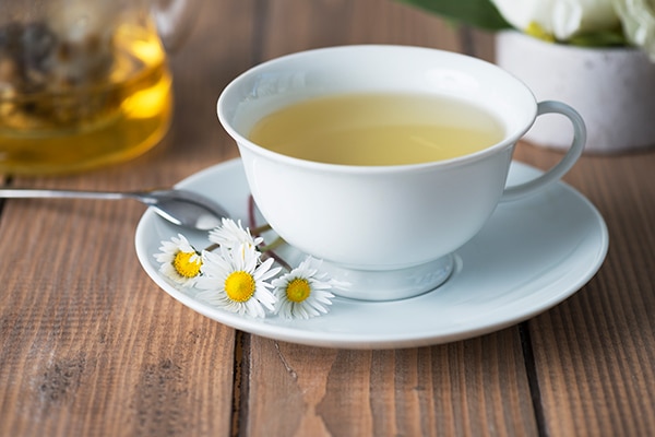 cup of camomile tea; health benefits of floral tea