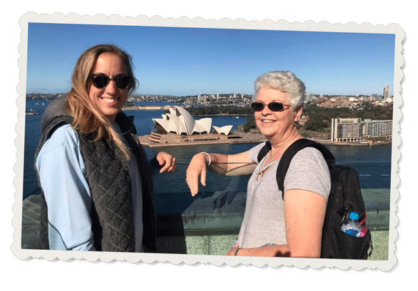 Beverly Grindele and her granddaughter, Sydney Opera House in background after thyroid surgery